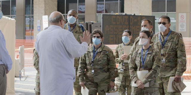 Dr. Mark Einstein (left) of University Hospital giving a tour.