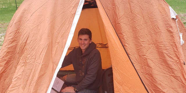 Cadet William Taylor, 18, pitched a tent outside his home in rural Pennsylvania to complete his school work from the Virginia Military Institute.