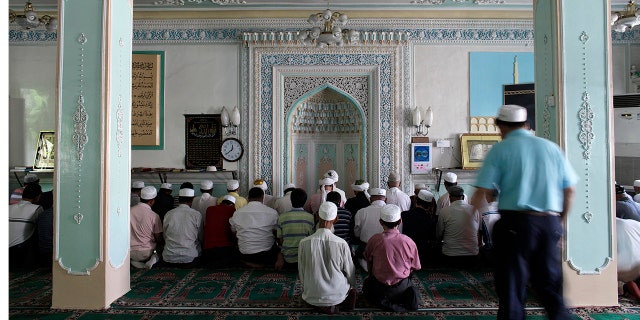 Ethnic Uighurs pray inside a mosque in Urumqi in China's Xinjiang Autonomous Region. 