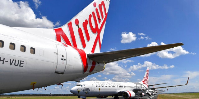 Grounded Virgin Australia planes are seen parked at Brisbane Airport in Australia on April 7, 2020. The airline — the nation's second-largest after Qantas — entered voluntary administration this week.