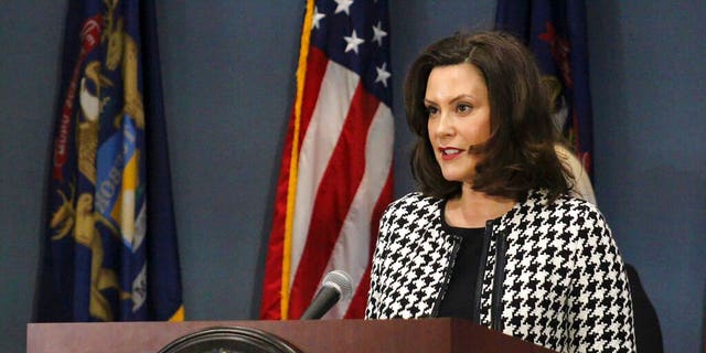 FILE - In this April 20, 2020, file photo, provided by the Michigan Office of the Governor, Michigan Gov. Gretchen Whitmer addresses the state in Lansing, Mich. Whitmer said Tuesday that President Donald Trump's plan to suspend immigration is distracting from efforts to combat the coronavirus pandemic and part of "inconsistent messages" that spread fear and put the public in "greater danger." (Michigan Office of the Governor via AP, Pool, File)