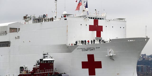 The U.S. Navy hospital ship USNS Comfort being escorted up the Hudson River on its way to New York City on March 30.