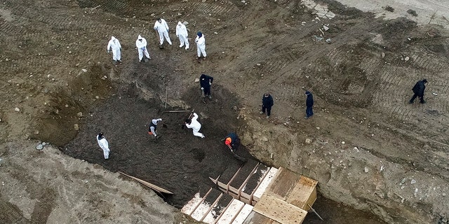 New York City’s medical examiner says the city will hold onto remains for 14 days before they will be transferred to Hart Island. (AP)