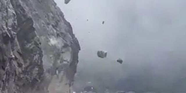 A landslide triggered a rush of boulders coming down a mountain in India.
