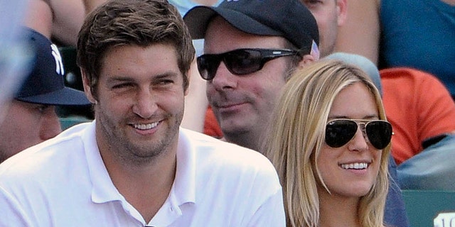 In this July 2, 2011, file photo, Chicago Bears quarterback Jay Cutler, left, and his wife Kristin Cavallari watch the Chicago Cubs play the Chicago White Sox during an interleague baseball game in Chicago. 