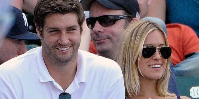 In this July 2, 2011, file photo, Chicago Bears quarterback Jay Cutler, left, and his wife Kristin Cavallari watch the Chicago Cubs play the Chicago White Sox during an interleague baseball game in Chicago.