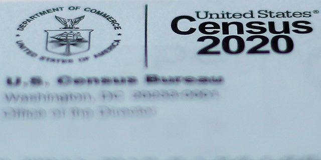 This April 5, 2020, photo shows a 2020 census letter mailed to a U.S. resident in Detroit. The U.S. Census Bureau needs more time to wrap up the once-a-decade count because of the coronavirus, opening the possibility of delays in drawing new legislative districts that could help determine what political party is in power, what laws pass or fail and whether communities of color get a voice in their states. (AP Photo/Paul Sancya)