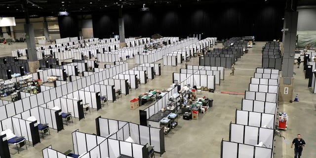 Rows of patient beds are shown at a military field hospital at the CenturyLink Field Event Center in Seattle on Sunday. (AP Photo/Ted S. Warren)