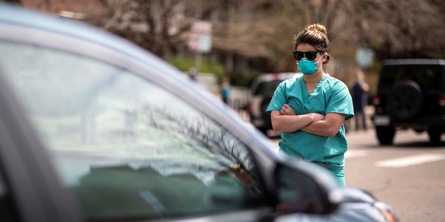 Healthcare workers face off against anti-lockdown protesters in Colorado