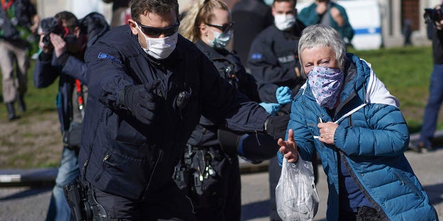 Germany has drafted a plan which will require citizens to wear masks in public if the country's lockdown is lifted on April 19. (Joerg Carstensen/dpa via AP)