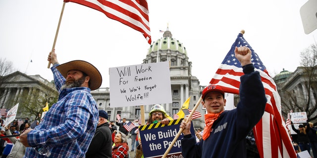 Protesters demonstrated at the state Capitol in Harrisburg, Pa., on April 20 to  demand that Gov. Tom Wolf reopen Pennsylvania's economy even as new social-distancing mandates took effect at stores and other commercial buildings. (AP Photo/Matt Rourke)