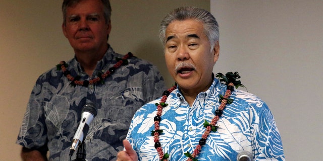March 3, 2020: Gov. David Ige speaks to reporters at the state Department of Health's laboratory in Pearl City, Hawaii. On Saturday, April 25, 2020, Ige extended the state's state-at-home order and the mandatory quarantine for visitors through May 31. 