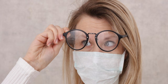 Wearing a tissue under the top of your mask can also help to prevent lenses from fogging. (iStock)