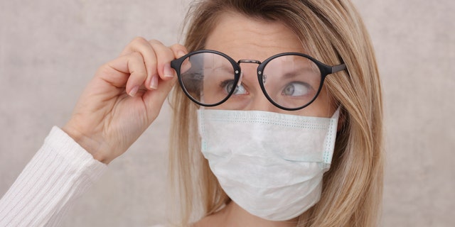 Wearing a tissue under the top of your mask can also help to prevent lenses from fogging. (iStock)