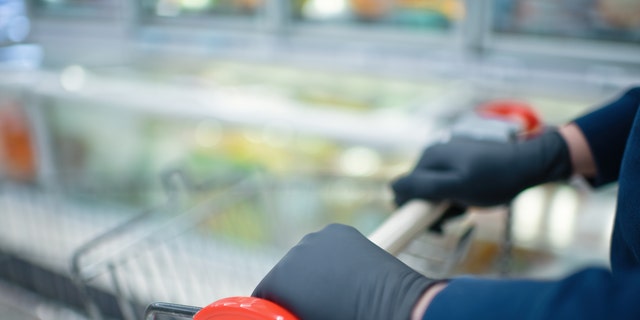 “Wearing gloves if you’re just going to the grocery store isn’t going to be that protective,” one expert told the outlet. (iStock)