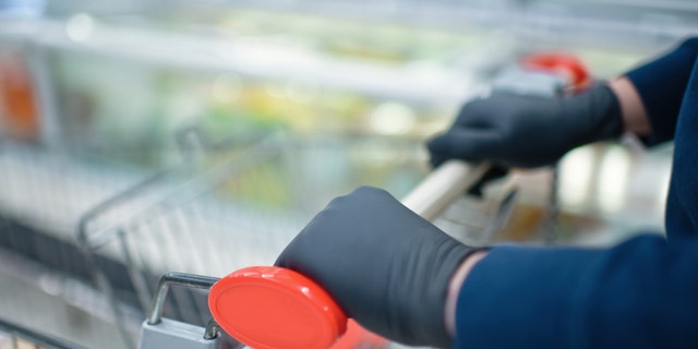 “Wearing gloves if you’re just going to the grocery store isn’t going to be that protective,” one expert told the outlet. (iStock)