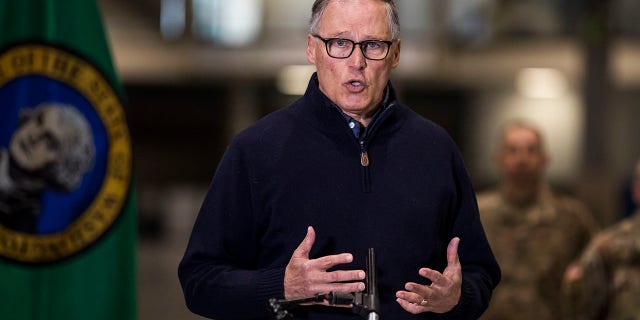 Inslee discusses the deployment of a field hospital at CenturyLink Field Event Center on March 28 in Seattle, Wash. (Amanda Snyder/The Seattle Times via AP, Pool)