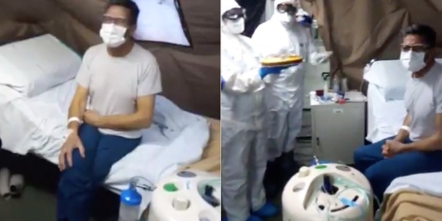 Medics wish a happy birthday to a man named Bruno at the the Italian Army’s field hospital in the northern Italian city of Piacenza on Monday.