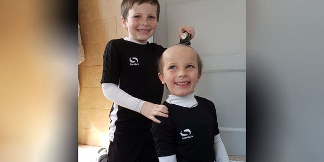 Kevin Moore says that he decided to check out what his two children, ages 5 and 7, were doing when he heard them both giggling hysterically.