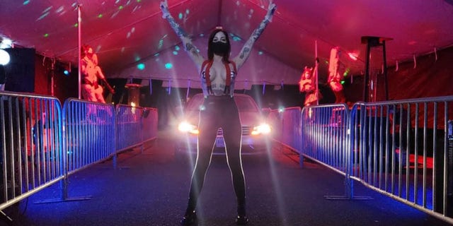 Shon Boulden, owner of the Lucky Devil Lounge, said the club's dancers, including Poni, seen above, are "happy to be working and be labeled as essential workers."