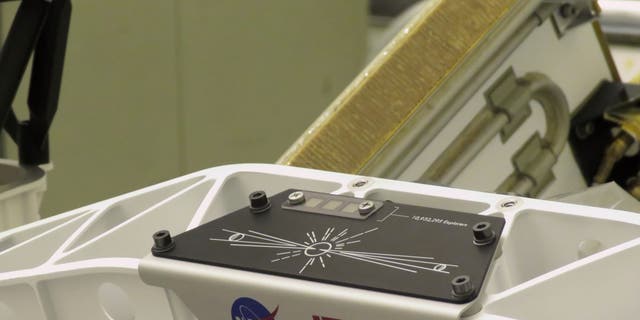 The “Send Your Name to Mars” logo is installed on the Mars Perseverance rover on March 16, 2020, inside the Payload Hazardous Servicing Facility at NASA’s Kennedy Space Center in Florida. Credits: NASA/JPL