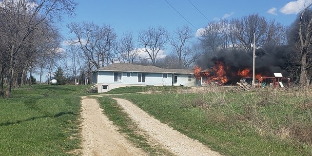 The Villegas family's home burning down in Odessa, Mo., on Sunday. The family lost everything in the fire but their town rallied together to help them.