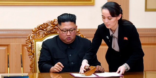 In this September 19, 2018 file photo, Kim Yo Jong, right, sister of North Korean leader Kim Jong Un, helps Kim sign a joint statement after the summit with South Korean President Moon Jae-in at the Paekhwawon State Guesthouse in Pyongyang .