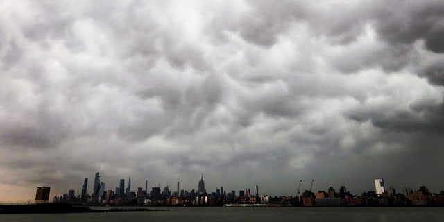 A thunderstorm passes over midtown Manhattan and the Empire State Building in New York City, April 21, 2020. A "gustnado" was reported in Northern Manhattan from the storms.
