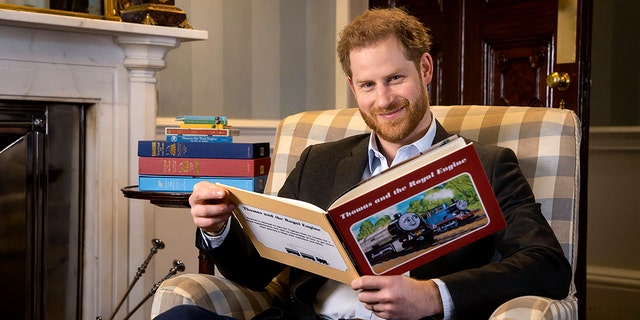 In this January 2020 photo and made available on Monday April 27, 2020 by Mattel, Britain's Prince Harry poses for a photo during the recording of his introduction to the new animated special 'Thomas & Friends: The Royal Engine'. Set when Prince Harry's father, Prince Charles was a boy, Thomas has to take Sir Topham Hatt, the controller of the railway, to Buckingham Palace to receive an honor. The special will be screened in the US on Netflix on 1 May 2020 and in the UK on Channel 5 Milkshake at 9:05 am on 2 May 2020. (Dave Poultney/Mattel via AP)