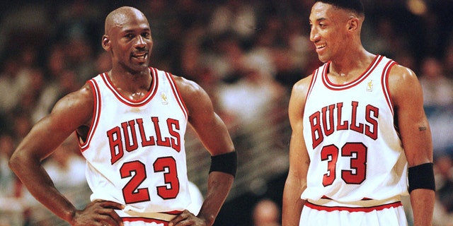 Michael Jordan (left) and Scottie Pippen of the Chicago Bulls talk during the final minutes of their game May 22, 1997, in the NBA Eastern Conference finals against the Miami Heat at the United Center in Chicago, Illinois. The Bulls won the game 75-68 to lead the series 2-0.