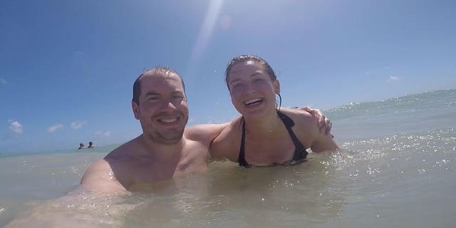 Cassie and Simon Woods in the sea in the Dominican Republic in 2018.