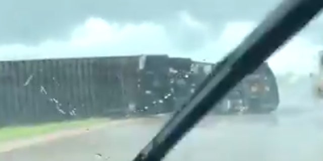 An overturned tractor-trailer on Interstate 35 after a reported tornado on Wednesday, April 22, 2020.