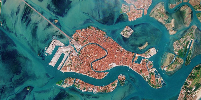 The satellite image of Venice captured April 13, 2020, by the European Space Agency's Copernicus Sentinels satellite fleet, which is dedicated to delivering data and imagery to the European Union's Copernicus environmental program. 