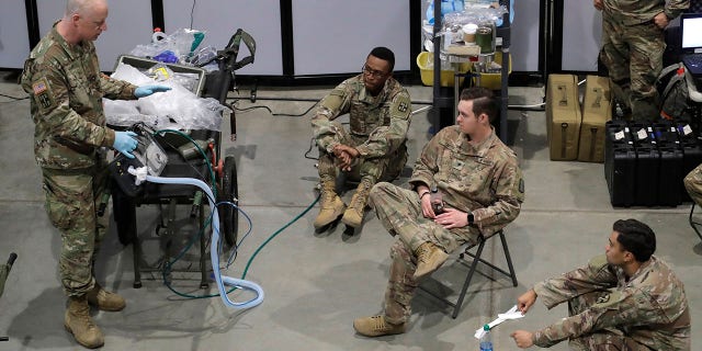 Soldiers took part in a ventilator training session at the site of a military field hospital on Sunday at the CenturyLink Field Event Center in Seattle. (AP Photo/Ted S. Warren)