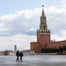 Two police officers patrol an empty Red Square in Moscow, Russia, April 20, 2020. 