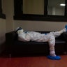 Doctor Giovanni Passeri relaxes in the doctor's lounge after completing a routine round of medical examinations during a night shift in his ward in the COVID-19 section of the Maggiore Hospital in Parma, Italy, April 8, 2020. 