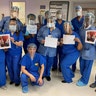 The Operating Room staff at Trinitas Regional Medical Center wear face shields and hold thank-you notes lovingly made by 8-year old Bailey Erez, 10-year old Aaron and their mom, Elena. They are Elizabeth residents and neighbors of Leon Pirak, MD (far right), Chairman of Anesthesia at the Medical Center. The note says it all!