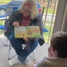 This is my friend who was dying to see her grandkids! They barely cracked the door so the kids could hear her read the book! She told me she cried as she drove away. She's the best Mimi ever!