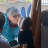 Nani crying because she can’t hold her grandkids Jason and Justin but gives them kisses through the glass.