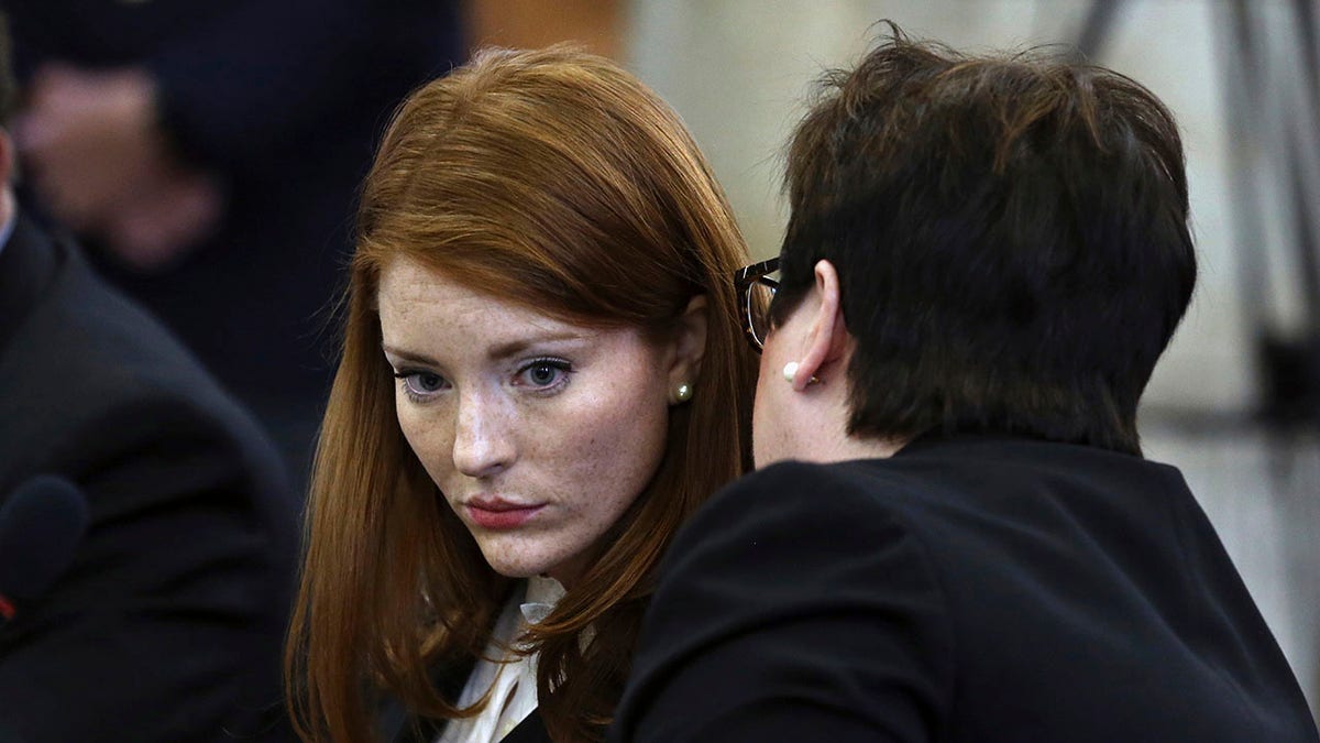 Katie Brennan, left, chief of staff at the New Jersey Housing and Mortgage Finance Agency, listens while testifying before the Select Oversight Committee at the Statehouse in Trenton, N.J., Dec. 4, 2018. (Associated Press)