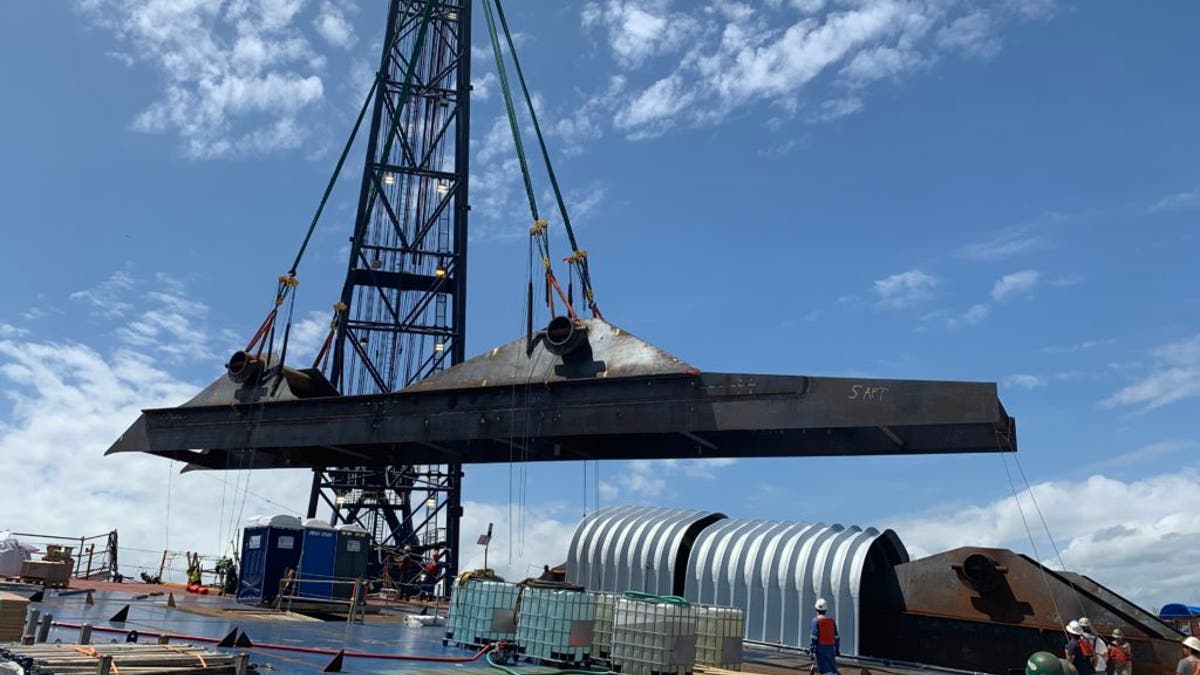 T&T Salvage installs the third and fourth lifting lugs on the M/V Golden Ray on April 17, 2020 in St. Simons Sound, Georgia.