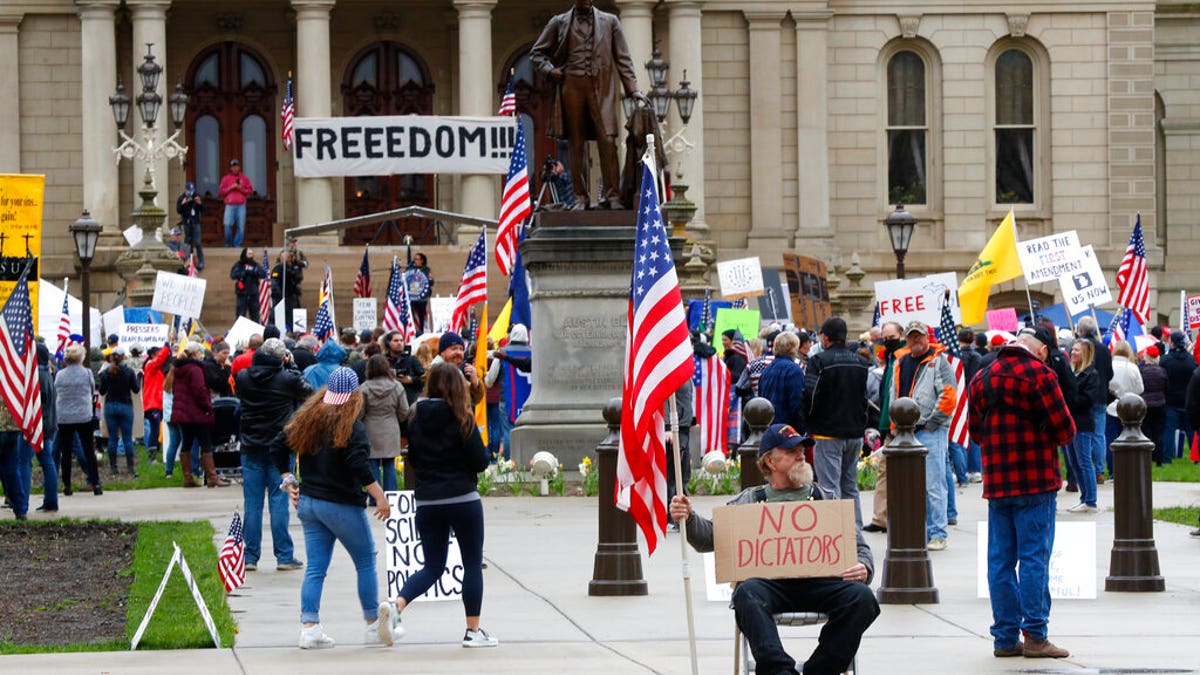 Protesters rally at the State Capitol in Lansing, Mich.
