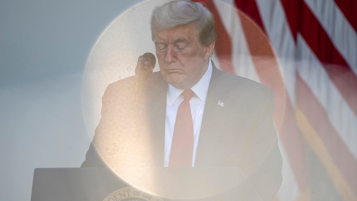 President Donald Trump bows his head in prayer during a White House National Day of Prayer Service in the Rose Garden of the White House, May 7, in Washington. (AP Photo/Alex Brandon)
