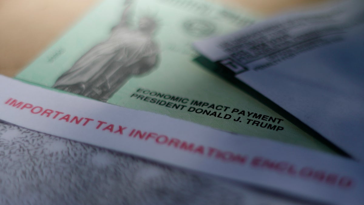 President Donald J. Trump's name printed on a stimulus check issued by the IRS on April 23. A New York man was arrested Tuesday for allegedly stealing more than $12,000 worth of coronavirus stimulus checks from mailboxes, federal prosecutors said. (AP Photo/Eric Gay, File)
