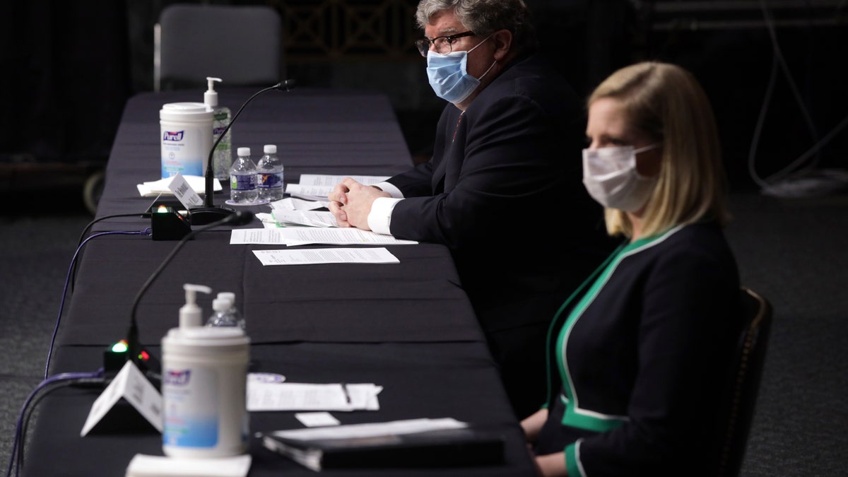 Brian Miller and Dana Wade at the hearing of the Senate Banking, Housing, and Urban Affairs Committee Tuesday on Capitol Hill.
