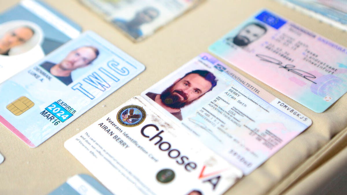 This photo released by the Venezuelan Miraflores presidential press office shows what Venezuelan authorities identify as the the I.D. cards of former U.S. special forces citizen Airan Berry, right, and Luke Denman, left, in Caracas, Venezuela, Monday, May 4, 2020.
