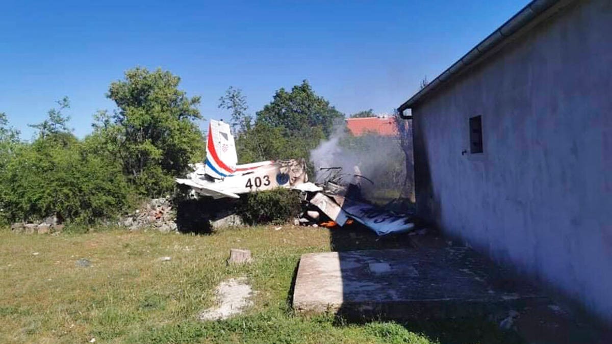 A Croatian air force plane burns after crashing in Biljane, Croatia, Thursday, May 7, 2020. (Diadora TV via AP)