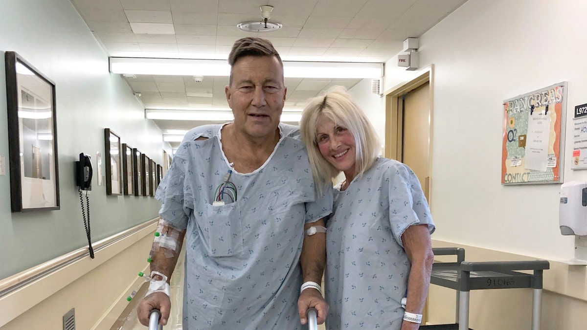 This April 1, 2020 photo provided by Herb Hoeptner shows him and his wife, Diane, at the UCSF hospital in San Francisco the day after surgery to donate one of her kidneys to him. Organ transplants have plummeted as COVID-19 swept through communities. But the team led by Dr. Chris Freise, interim transplant director at the University of California, San Francisco, allowed living kidney transplants for people like Herb Hoeptner, who was on the brink of needing dialysis. "When you have kidneys that have nothing left, you either go on dialysis or you die. That was much more of a concern to me than coronavirus," said Hoeptner.