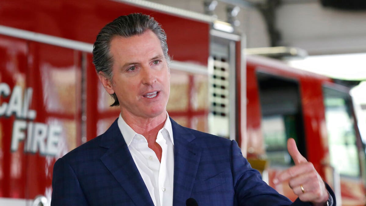 FILE: Gov. Gavin Newsom discusses his revised state budget proposal during a news conference at the CalFire/Cameron Park Fire Station in Cameron Park, Calif. 