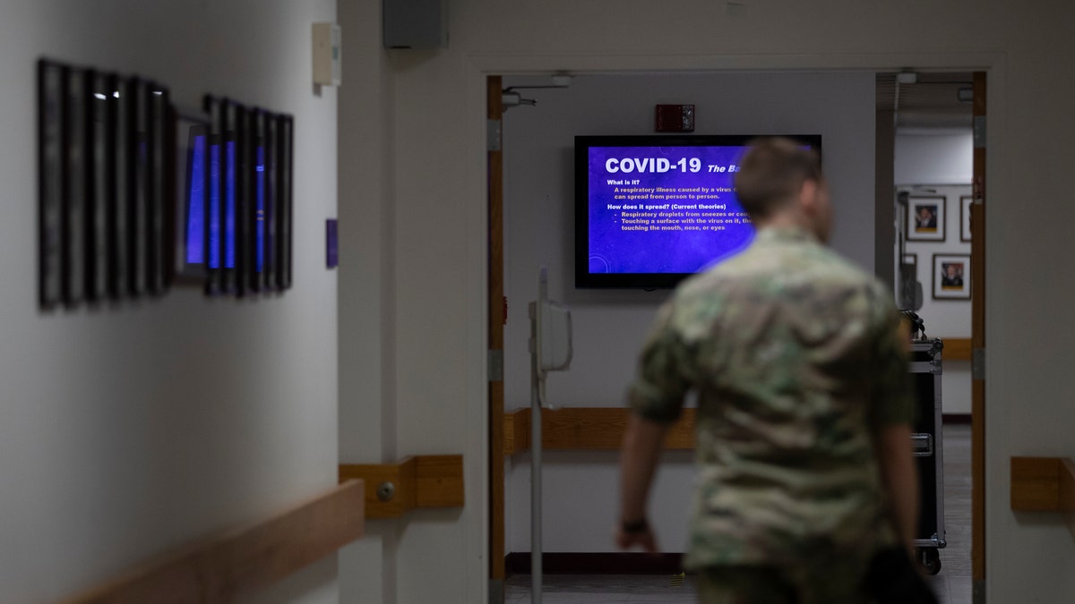 A member of the U.S. Army walks down a hall at Fort Meade, Md., back in March.